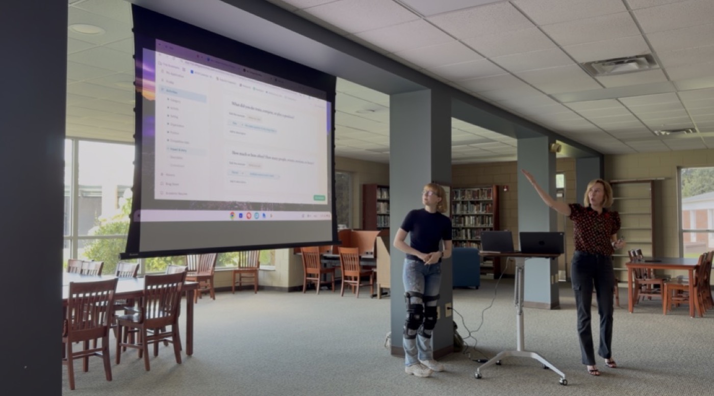Jessica Gardner presenting at a school.