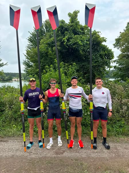 A student competing at a world rowing event.